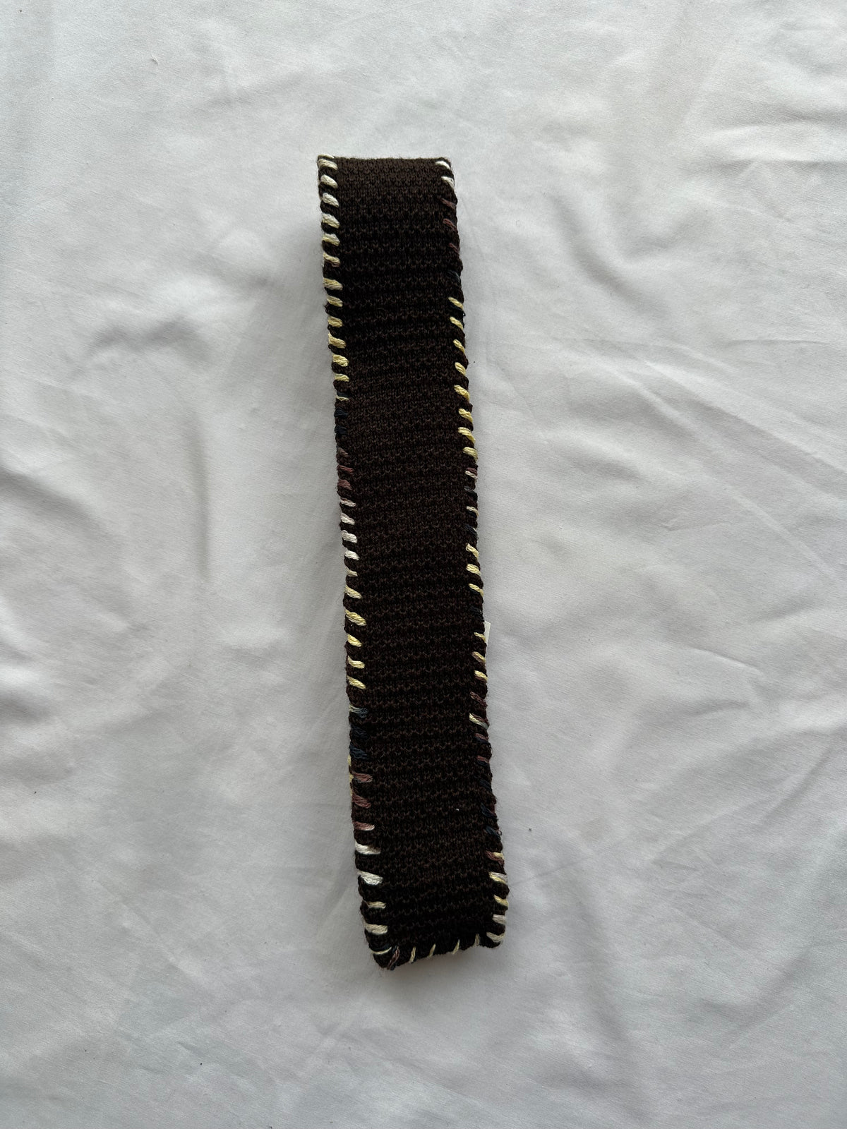 Embroidered knitted tie