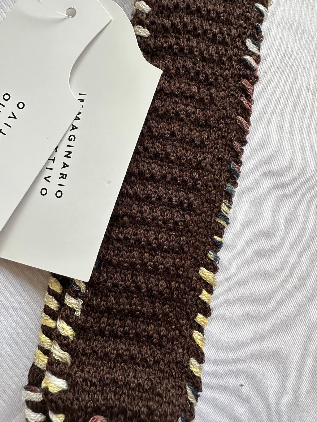 Embroidered knitted tie